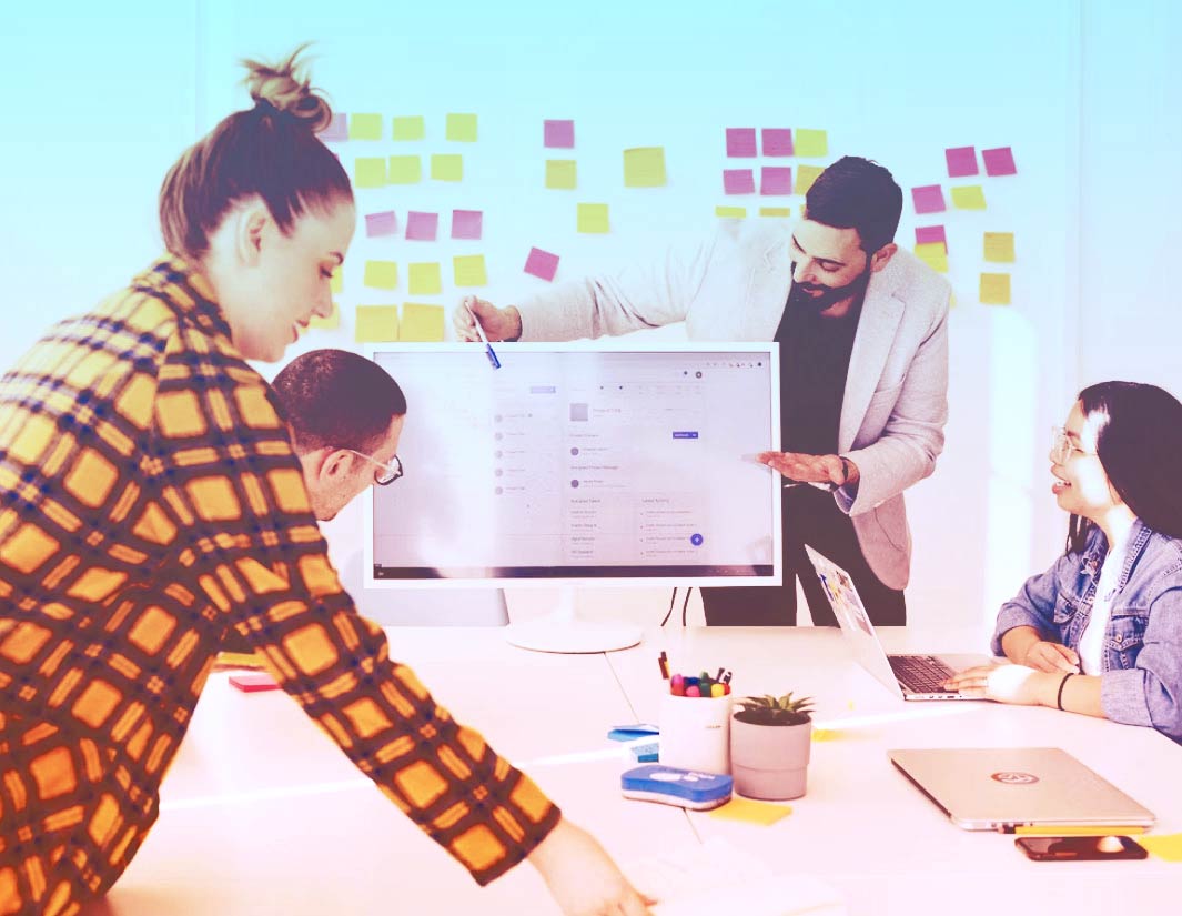 team collaboration discussing digital strategy and website planning in office